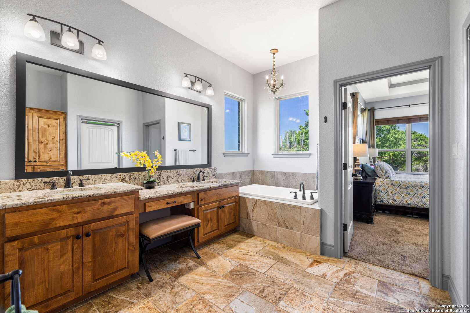 997 Kramer Road Harper, TX 78631 - Photo 21 of 45 a spacious bathroom with a tub sink and mirror