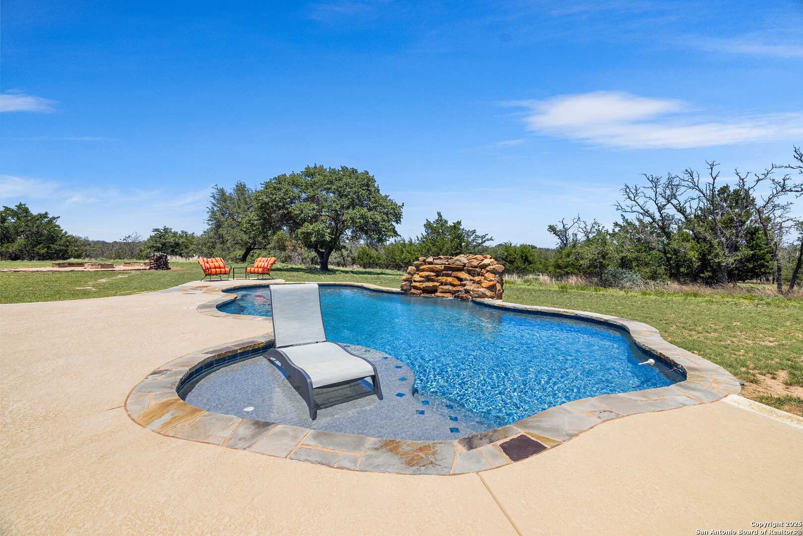 997 Kramer Road Harper, TX 78631 - Photo 35 of 45 a view of a swimming pool and a yard