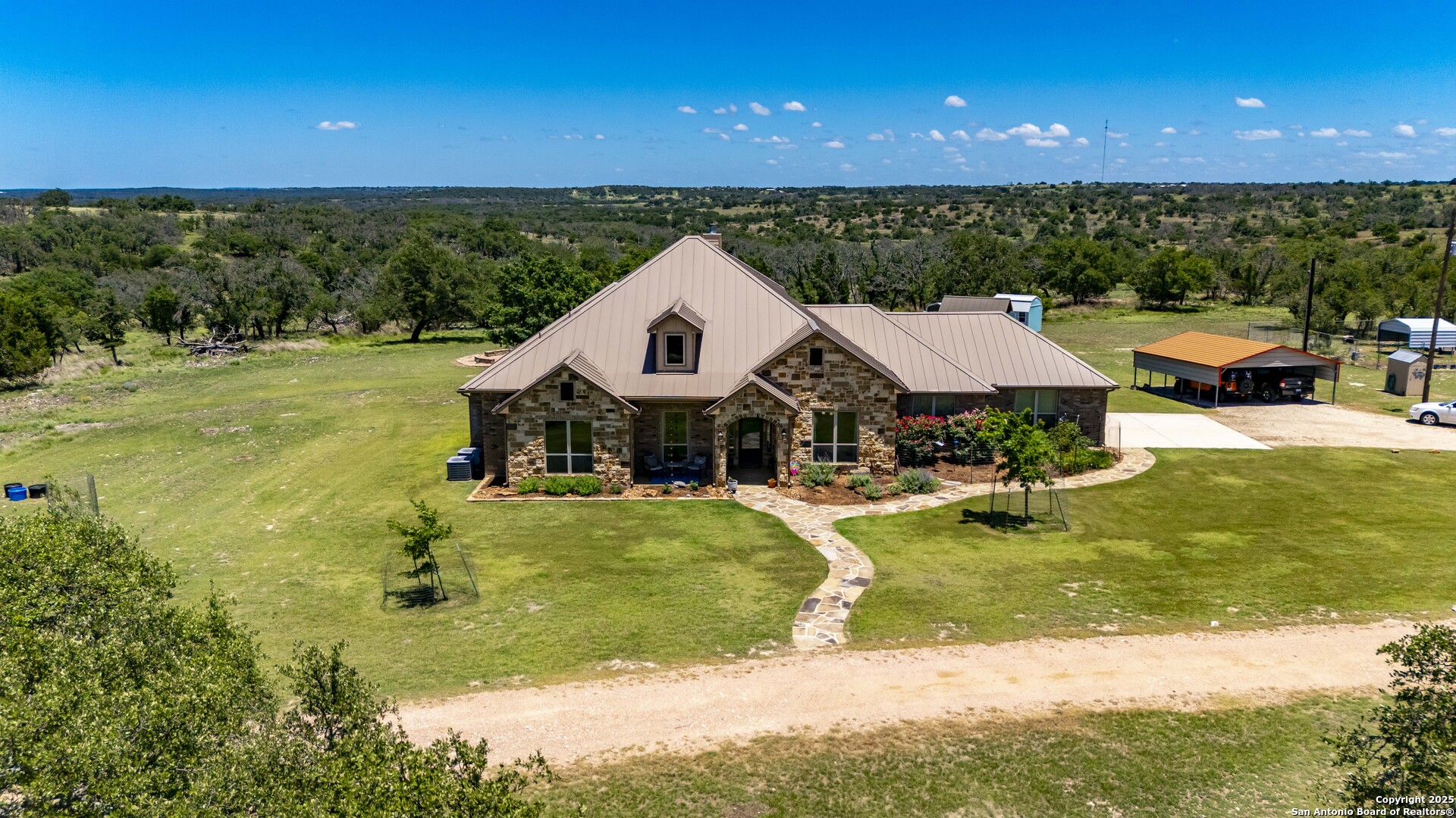 997 Kramer Road Harper, TX 78631 - Photo 8 of 45 a view of a house with yard and swimming pool