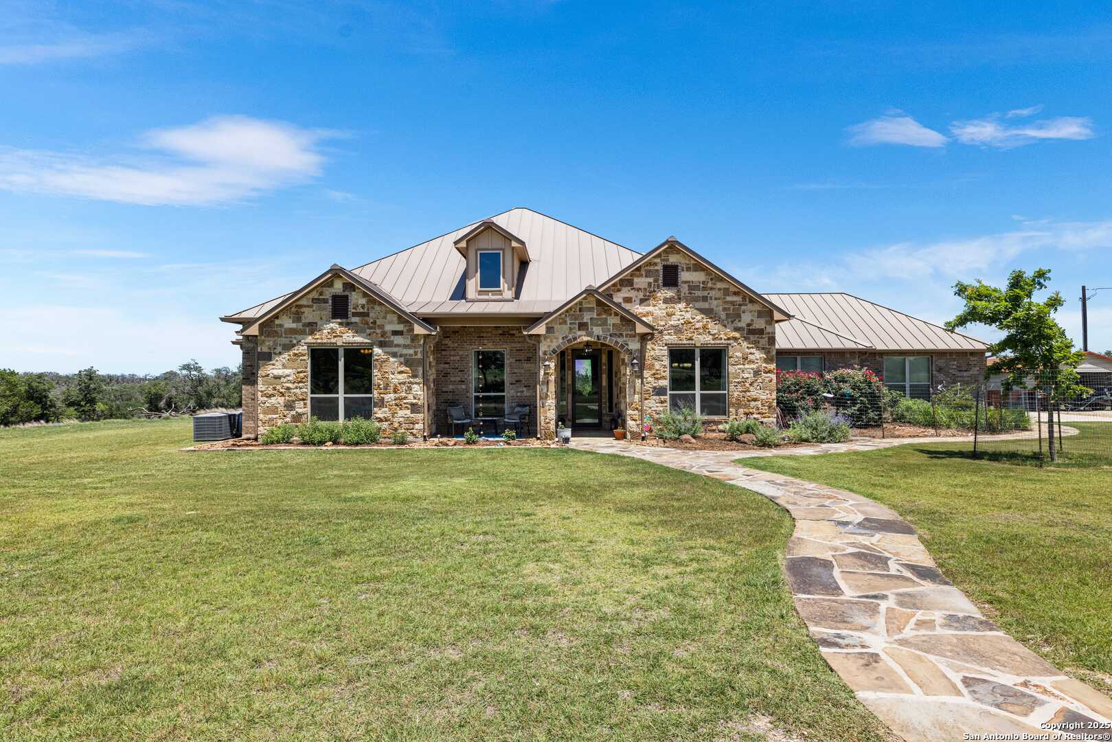 997 Kramer Road Harper, TX 78631 - Photo 10 of 45 a front view of a house with a yard