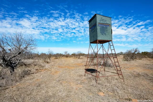 a view of a lake with a yard