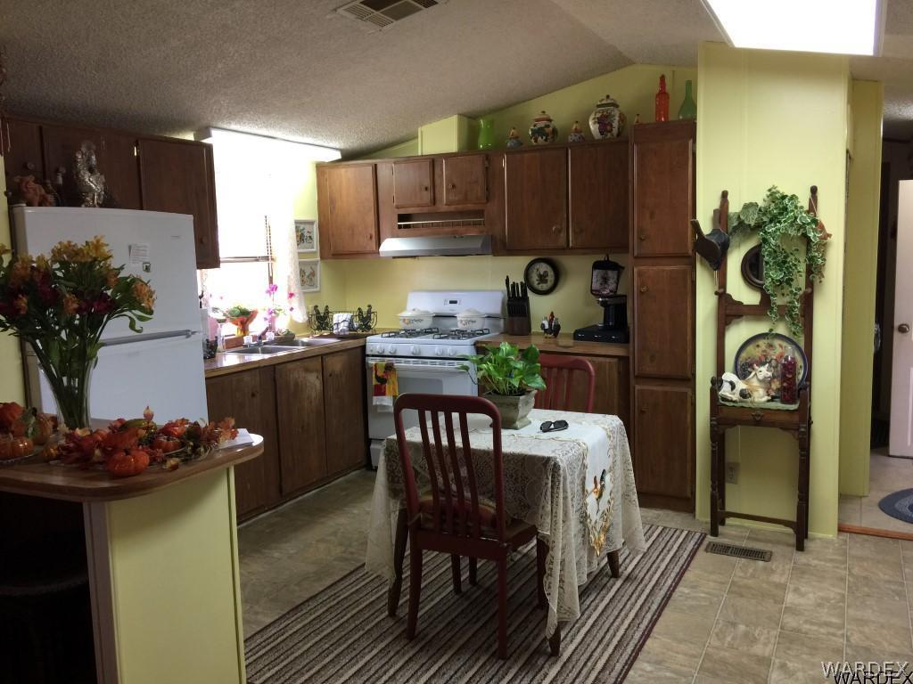 3580 Egar Road Golden Valley, AZ 86413 - Photo 9 of 28 Open KitchenDiningLiving Rm