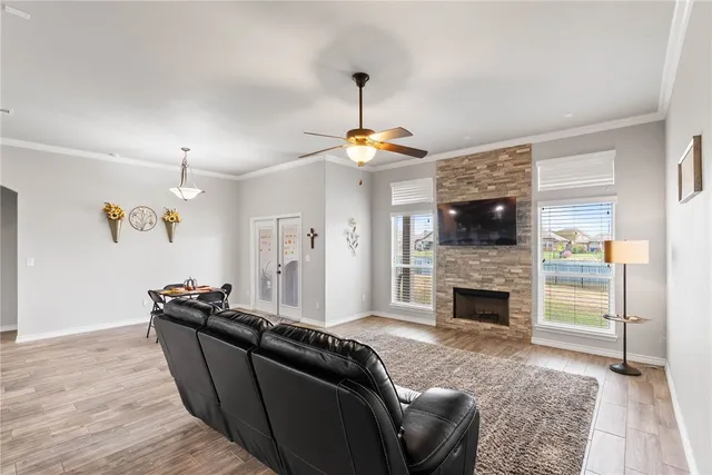 a living room with furniture and a fireplace