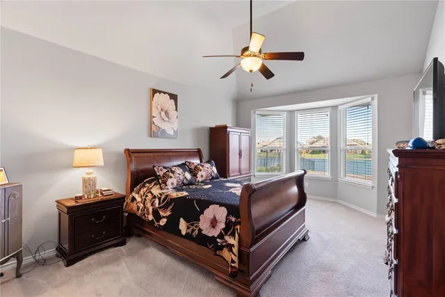 a bed room with a bed and a window