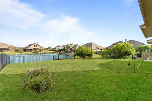 a view of a golf course with a lake