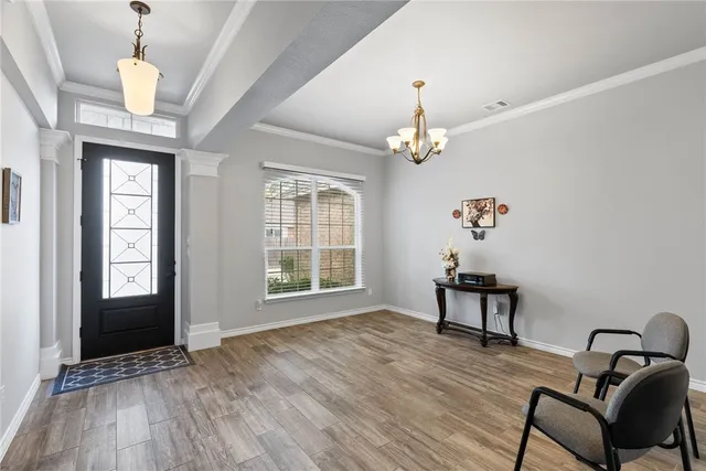a view of livingroom with furniture wooden floor and chandelier