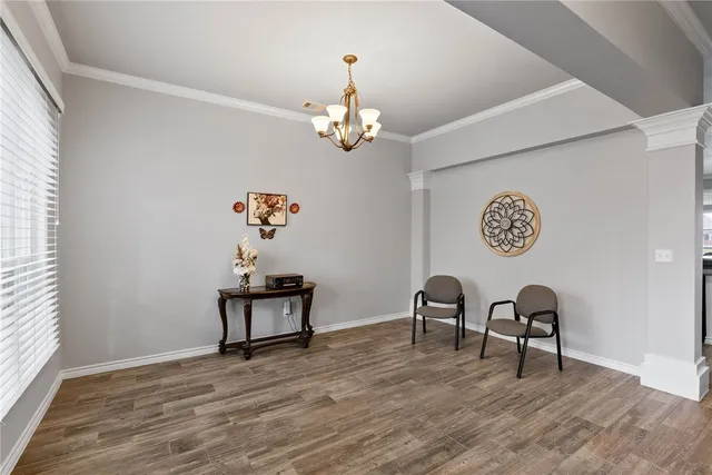 a view of a room that has a table and a chair