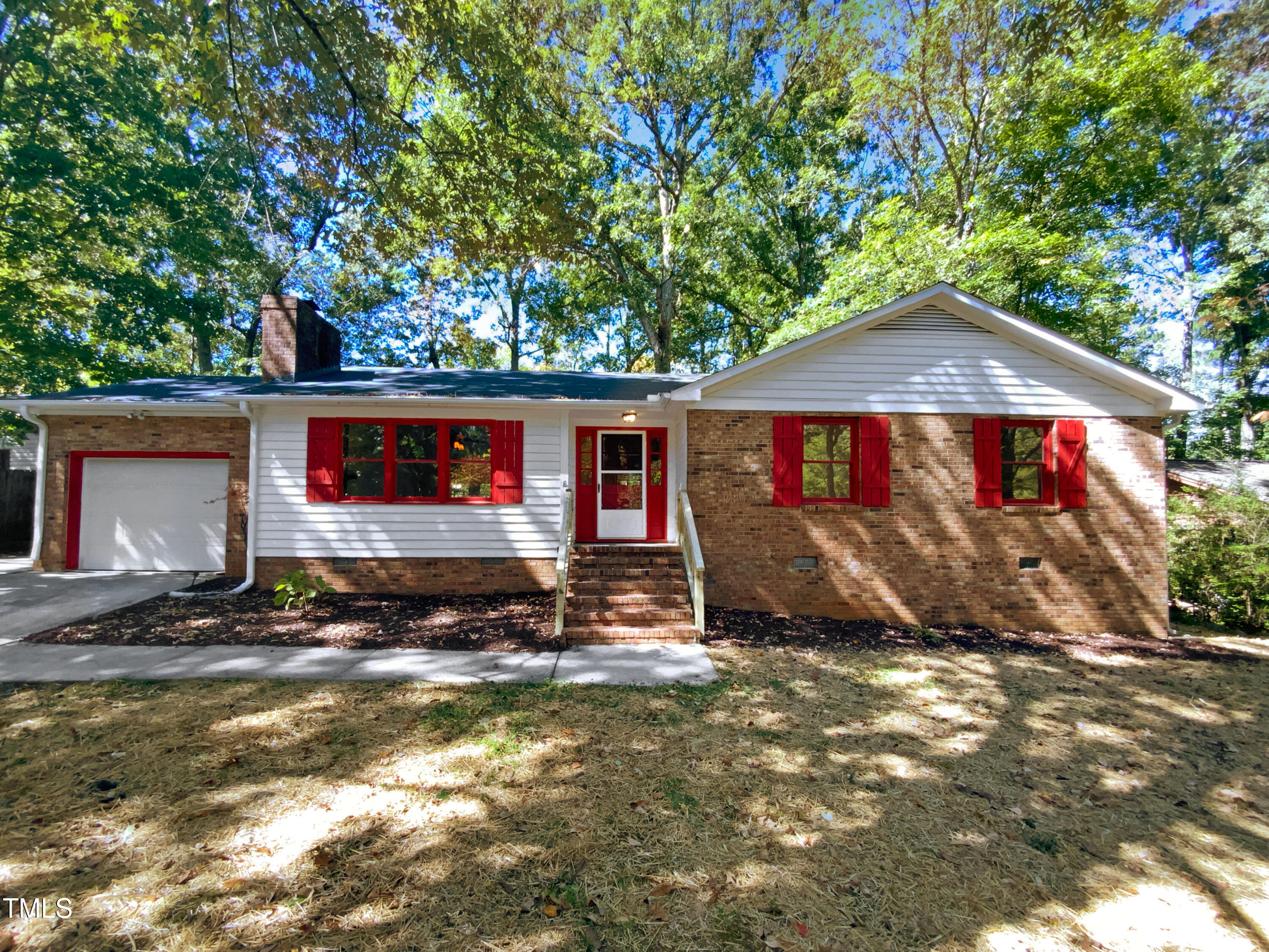 6605 Glendower Road Raleigh, NC 27613 - Photo 1 of 23 a front view of a house with a yard