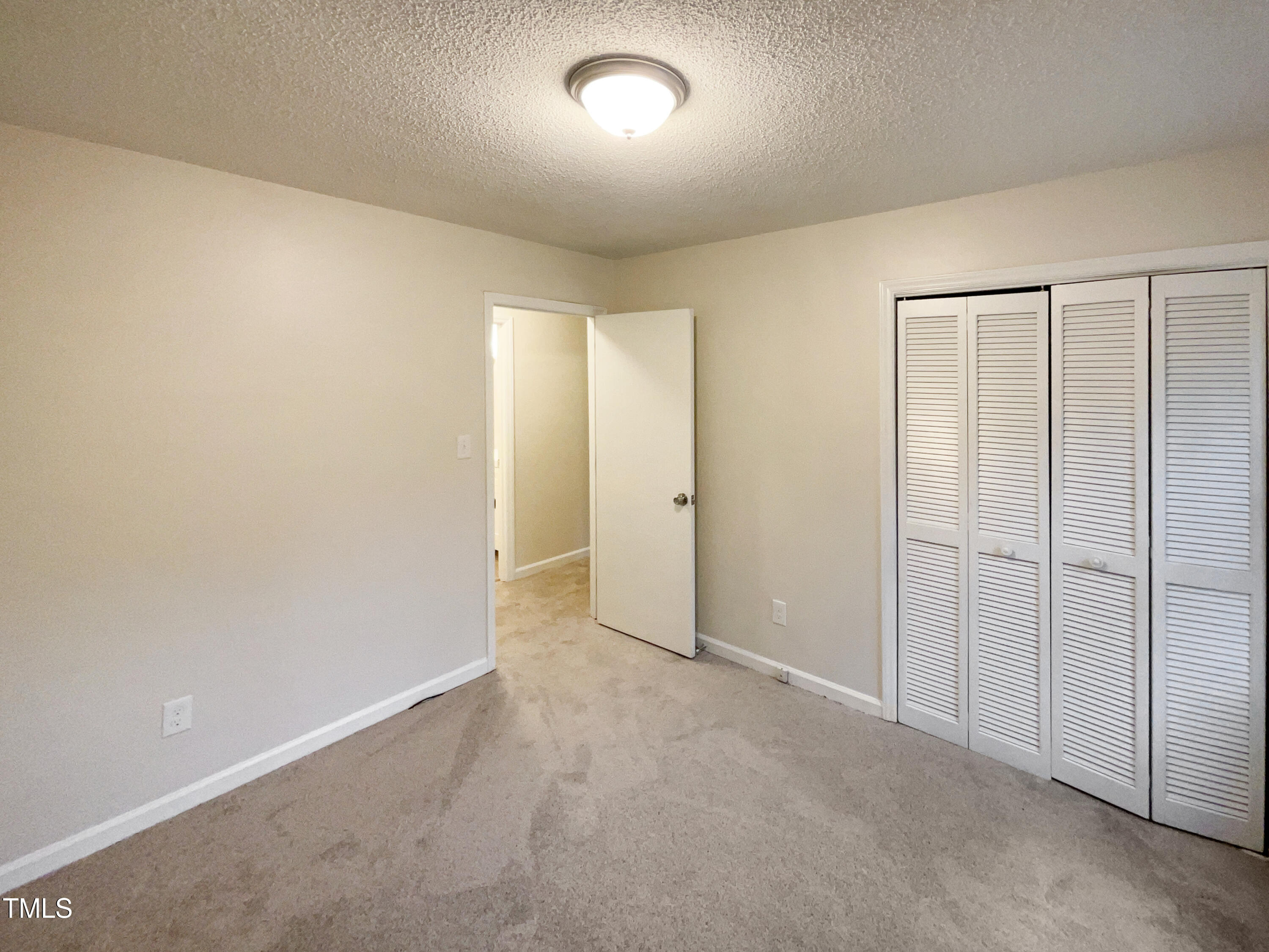 6605 Glendower Road Raleigh, NC 27613 - Photo 11 of 23 an empty room with closet area