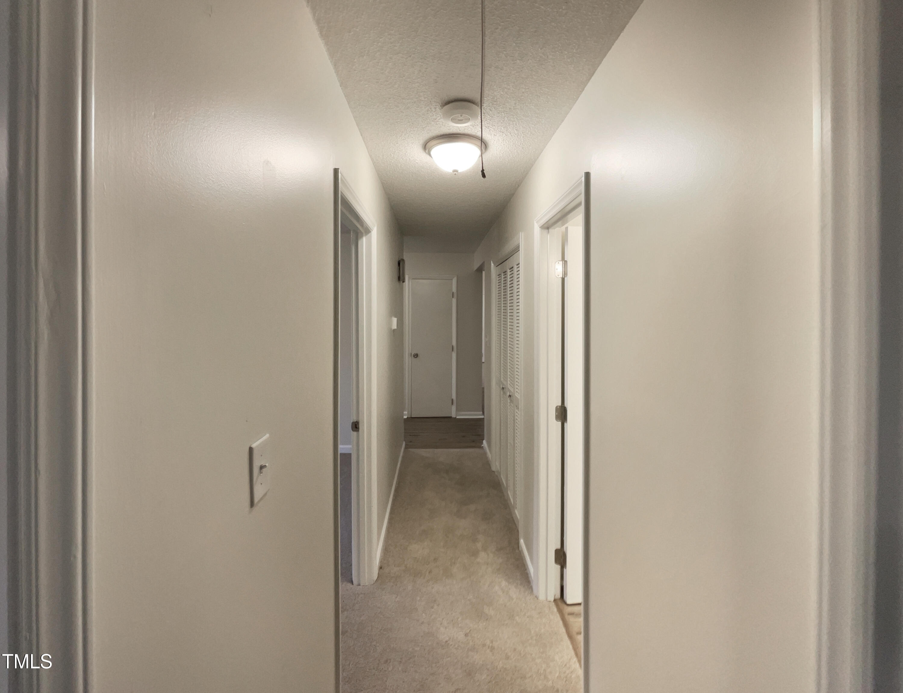 6605 Glendower Road Raleigh, NC 27613 - Photo 19 of 23 a view of a hallway
