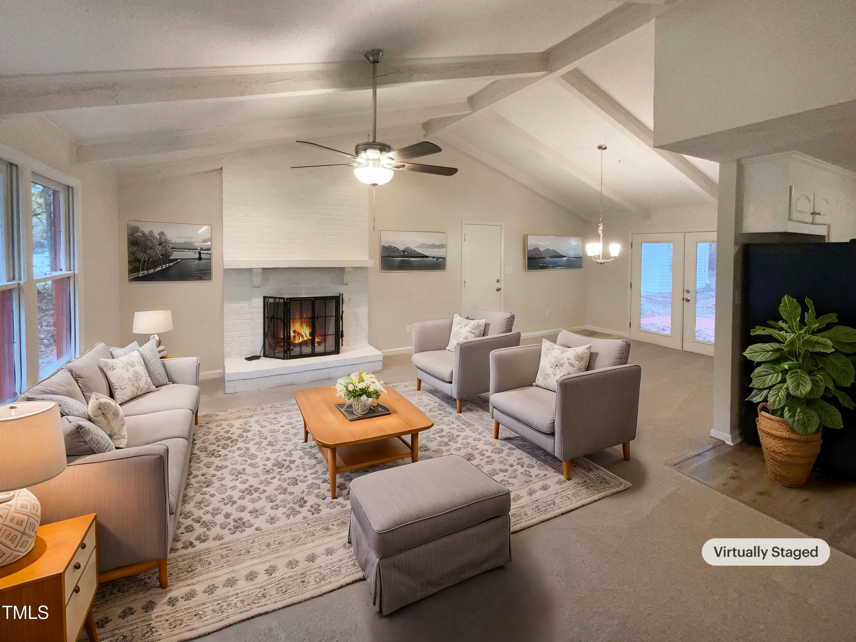 6605 Glendower Road Raleigh, NC 27613 - Photo 2 of 23 a living room with furniture potted plant and a fireplace