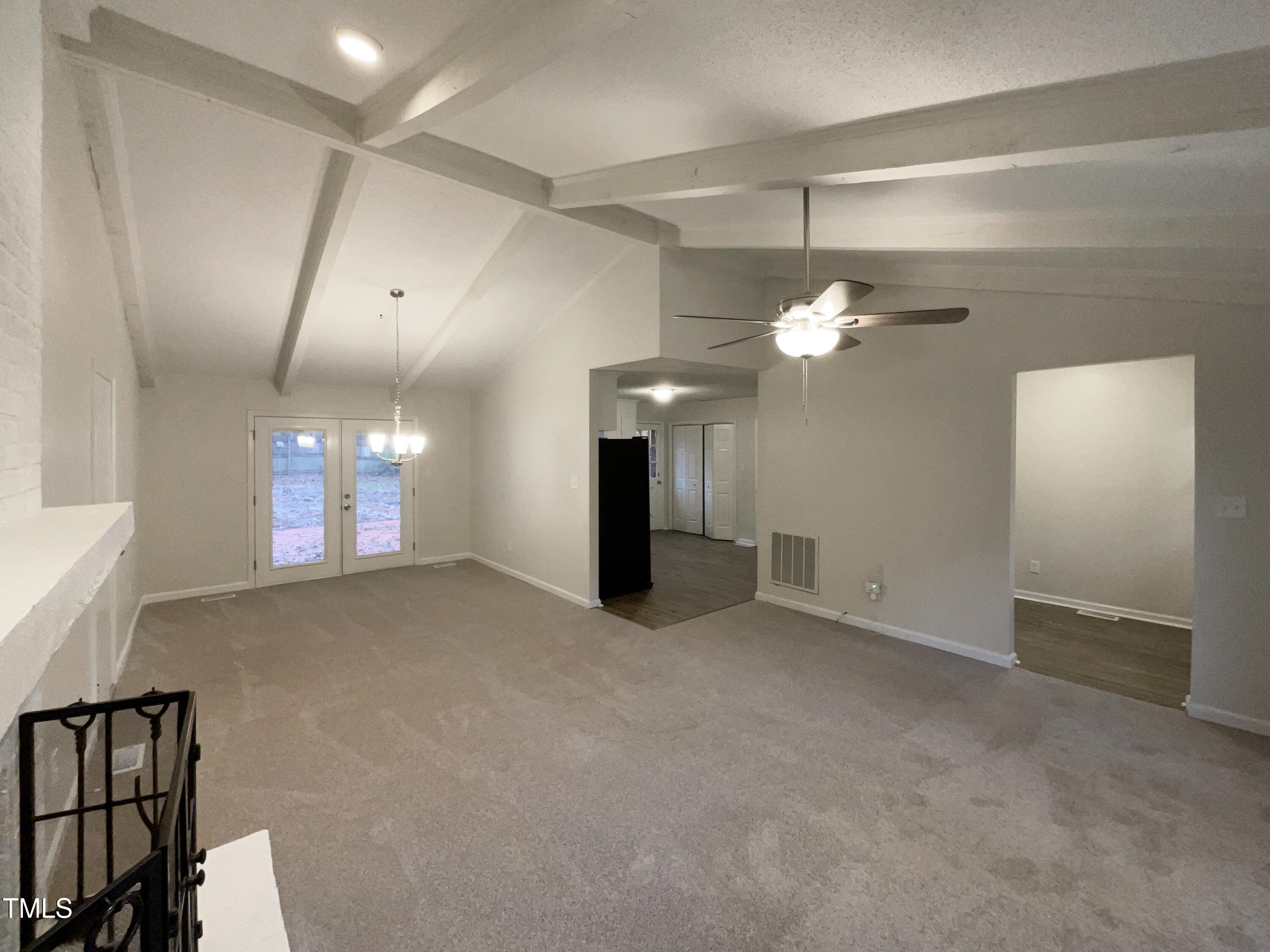6605 Glendower Road Raleigh, NC 27613 - Photo 21 of 23 a view of a chandelier in a room