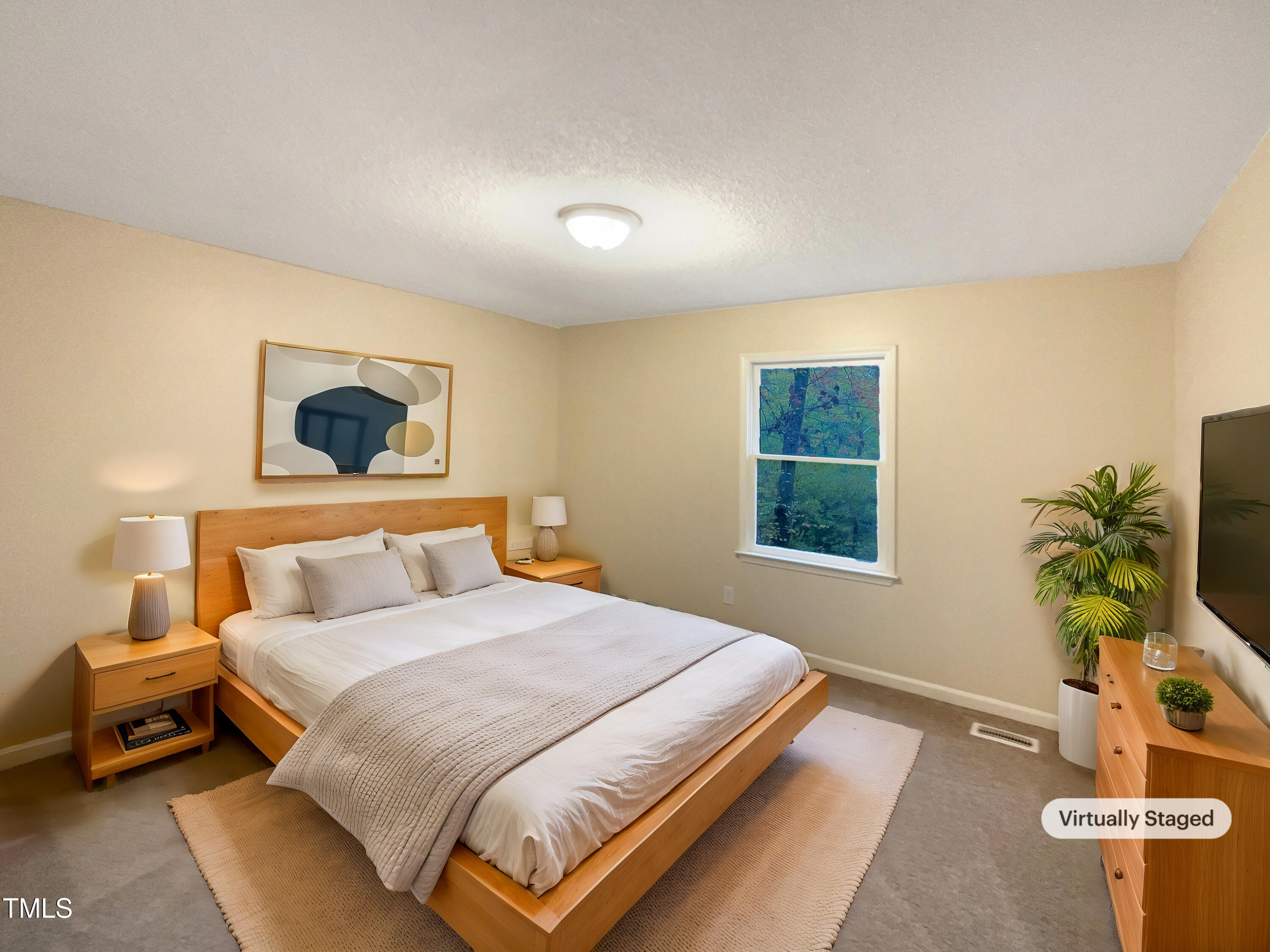 6605 Glendower Road Raleigh, NC 27613 - Photo 4 of 23 a bedroom with a bed and a potted plant