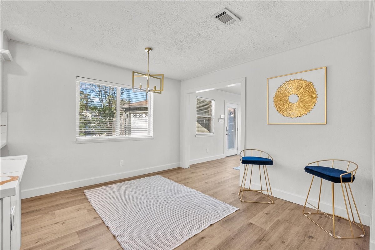 6702 Robinwick Court Spring, TX 77379 - Photo 11 of 41 a view of a livingroom with wooden floor and a ceiling fan