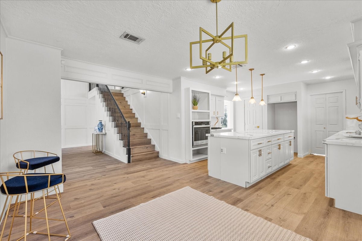 6702 Robinwick Court Spring, TX 77379 - Photo 12 of 41 a view of a kitchen and entryway with furniture