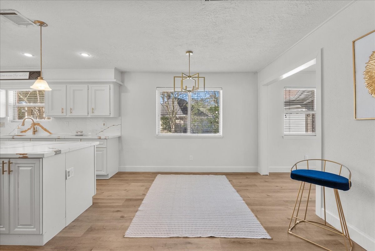 6702 Robinwick Court Spring, TX 77379 - Photo 10 of 41 a kitchen with kitchen island a counter space a sink cabinets and appliances