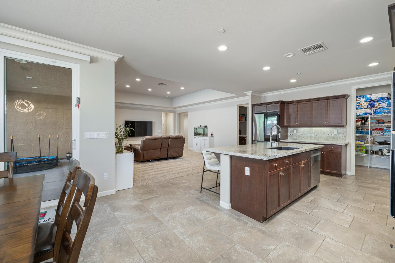 3573 Hermosa Avenue Clovis, CA 93619 - Photo 18 of 42 a kitchen with stainless steel appliances granite countertop a refrigerator and a sink
