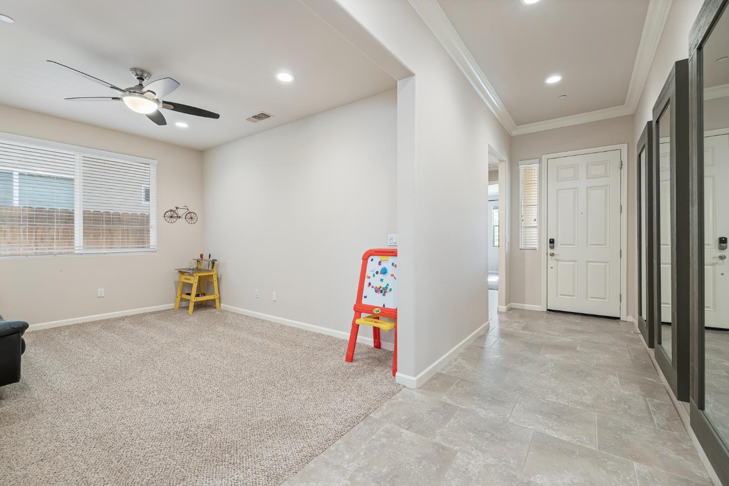3573 Hermosa Avenue Clovis, CA 93619 - Photo 26 of 42 an empty room with ceiling fan and window