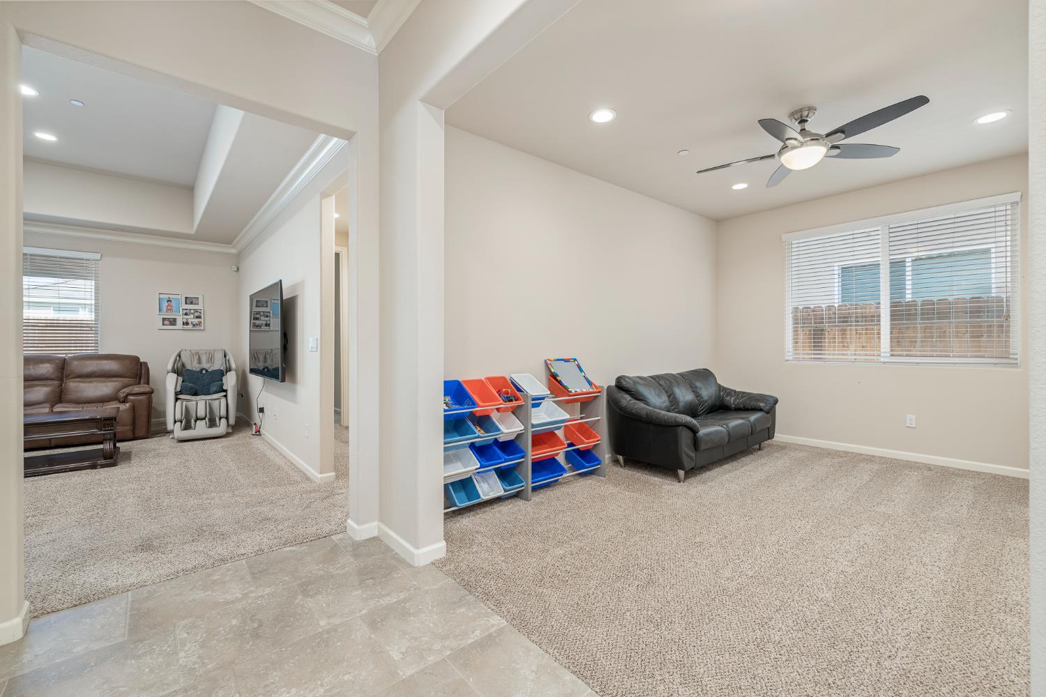 3573 Hermosa Avenue Clovis, CA 93619 - Photo 27 of 42 a living room with furniture and a flat screen tv