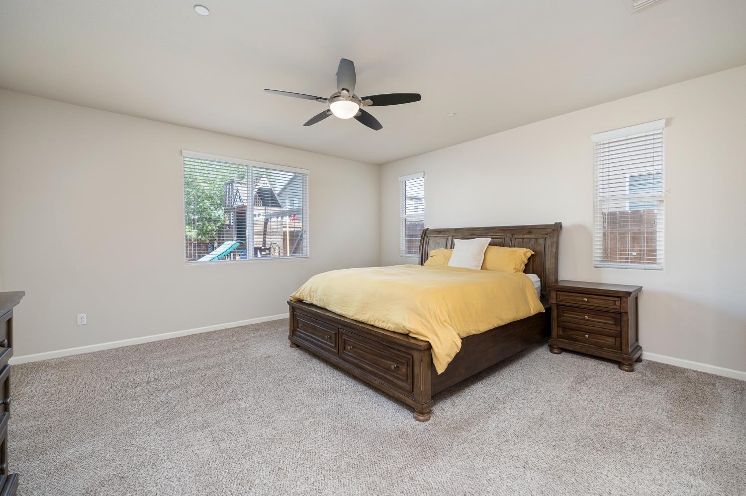 3573 Hermosa Avenue Clovis, CA 93619 - Photo 30 of 42 a spacious bedroom with a bed and a window