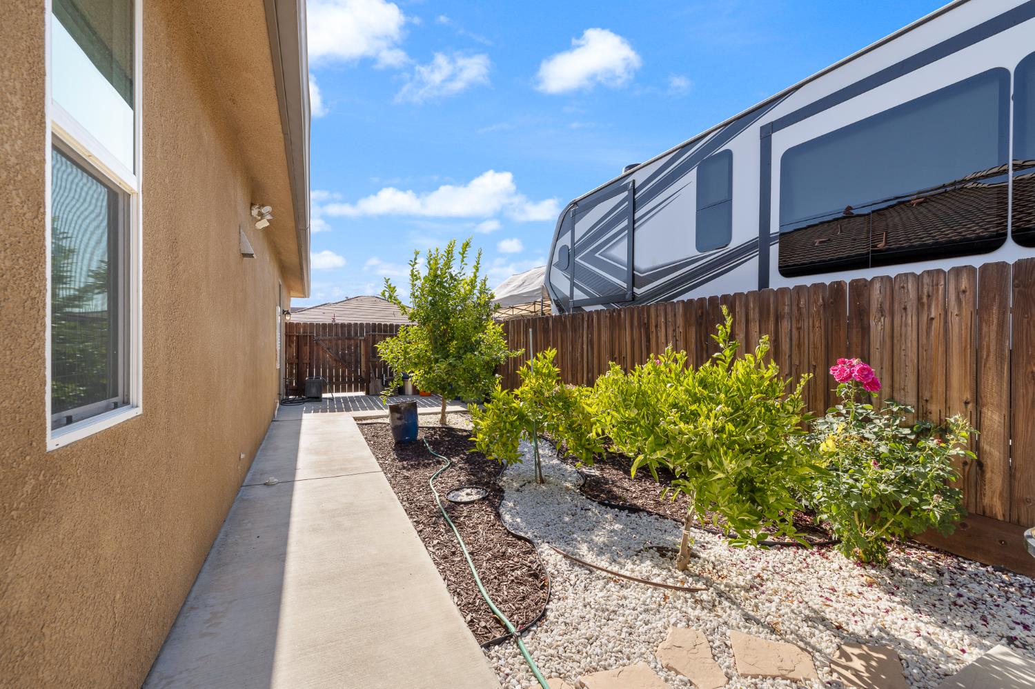 3573 Hermosa Avenue Clovis, CA 93619 - Photo 41 of 42 a view of a potted flower in the corridor