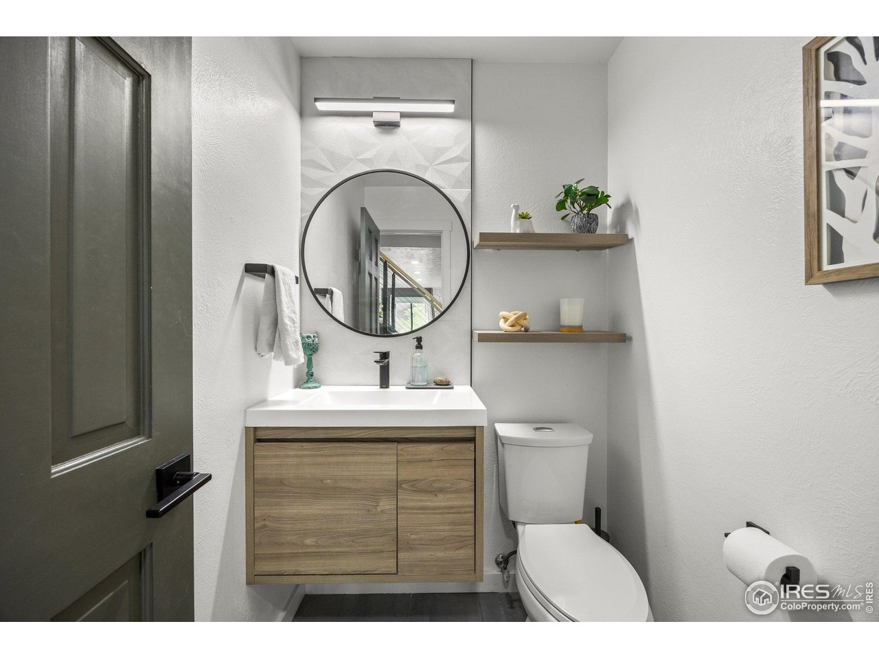 6969 Harvest Road Boulder, CO 80301 - Photo 12 of 39 a bathroom with a toilet a sink and mirror