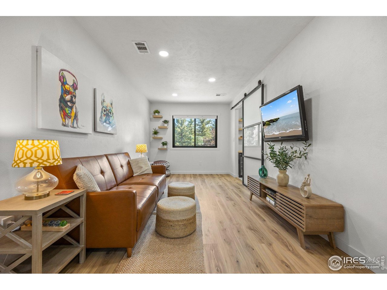 6969 Harvest Road Boulder, CO 80301 - Photo 16 of 39 a living room with furniture and a flat screen tv