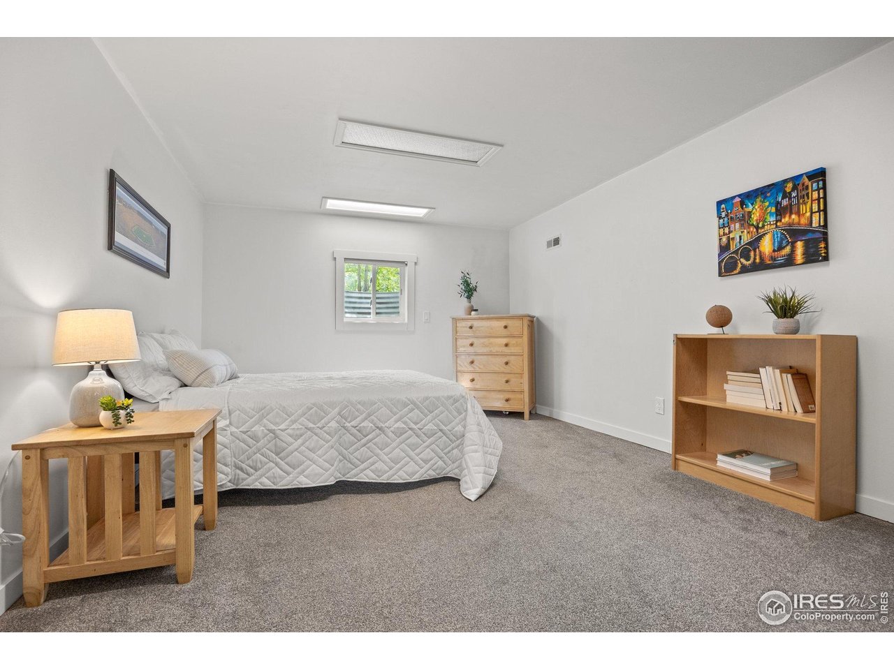 6969 Harvest Road Boulder, CO 80301 - Photo 22 of 39 a bedroom with a bed and a dresser in it