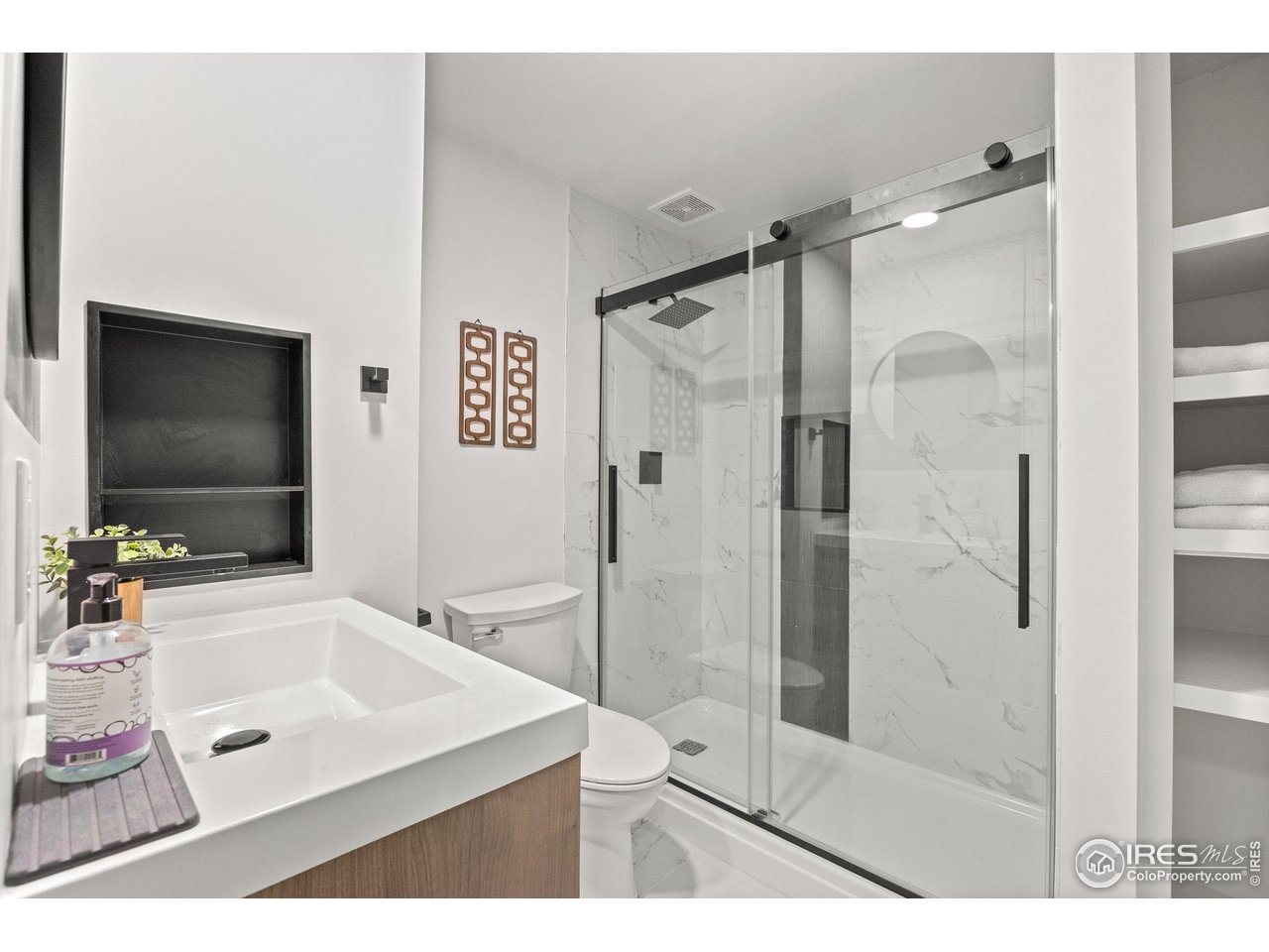 6969 Harvest Road Boulder, CO 80301 - Photo 23 of 39 a bathroom with a granite countertop sink mirror and shower