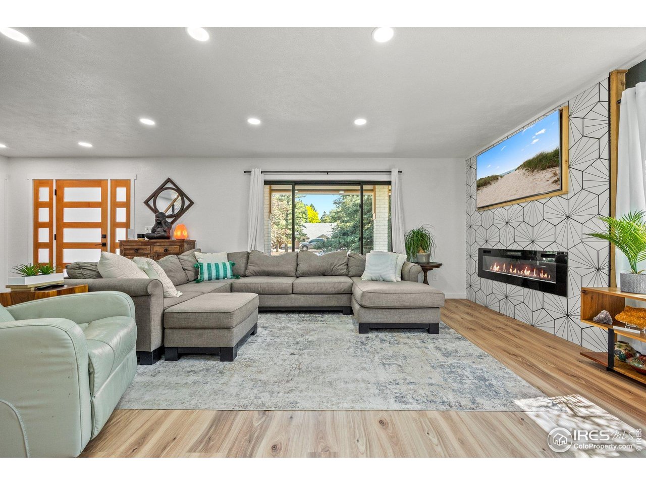 6969 Harvest Road Boulder, CO 80301 - Photo 3 of 39 a living room with furniture and a fireplace