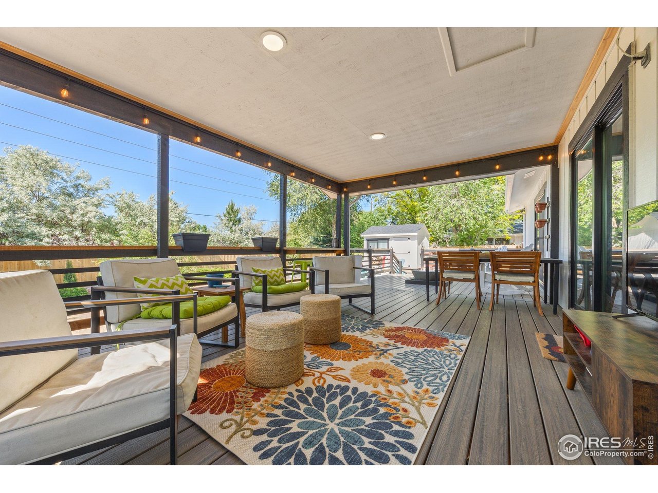 6969 Harvest Road Boulder, CO 80301 - Photo 31 of 39 a living room with furniture and a floor to ceiling window