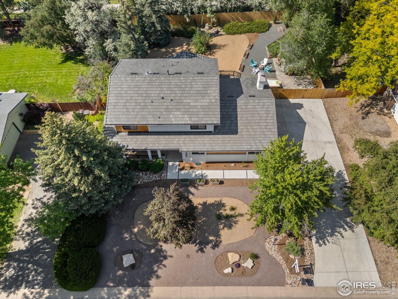 6969 Harvest Road Boulder, CO 80301 - Photo 32 of 39 an aerial view of a house with a yard and lake view