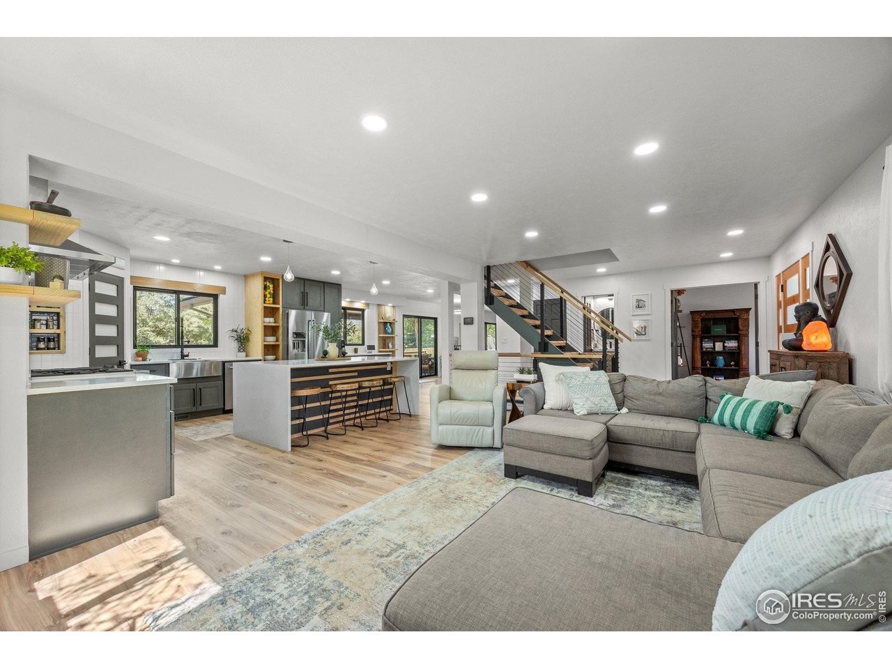 6969 Harvest Road Boulder, CO 80301 - Photo 4 of 39 a living room with furniture and kitchen view