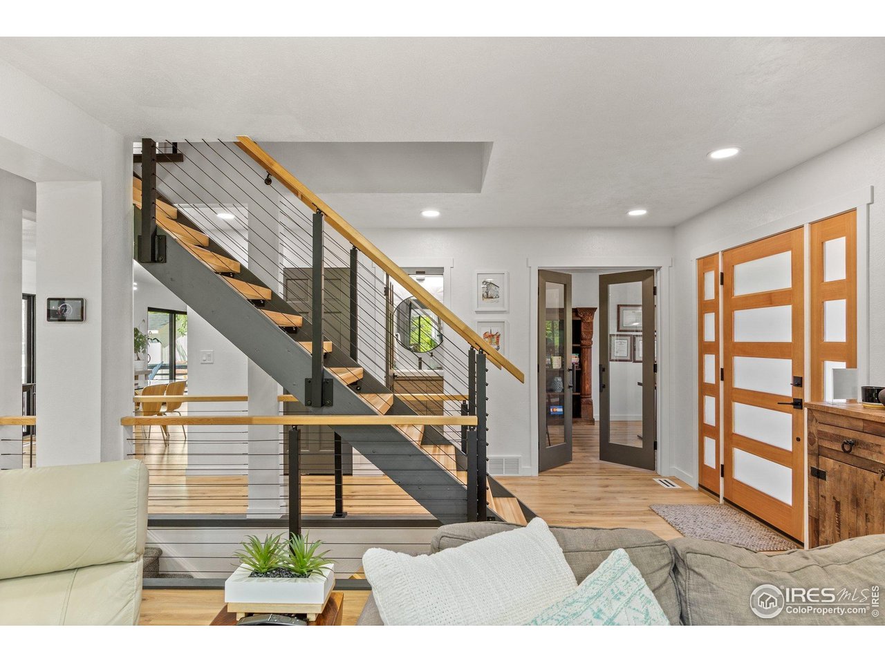 6969 Harvest Road Boulder, CO 80301 - Photo 5 of 39 a view of entryway and hall with wooden floor