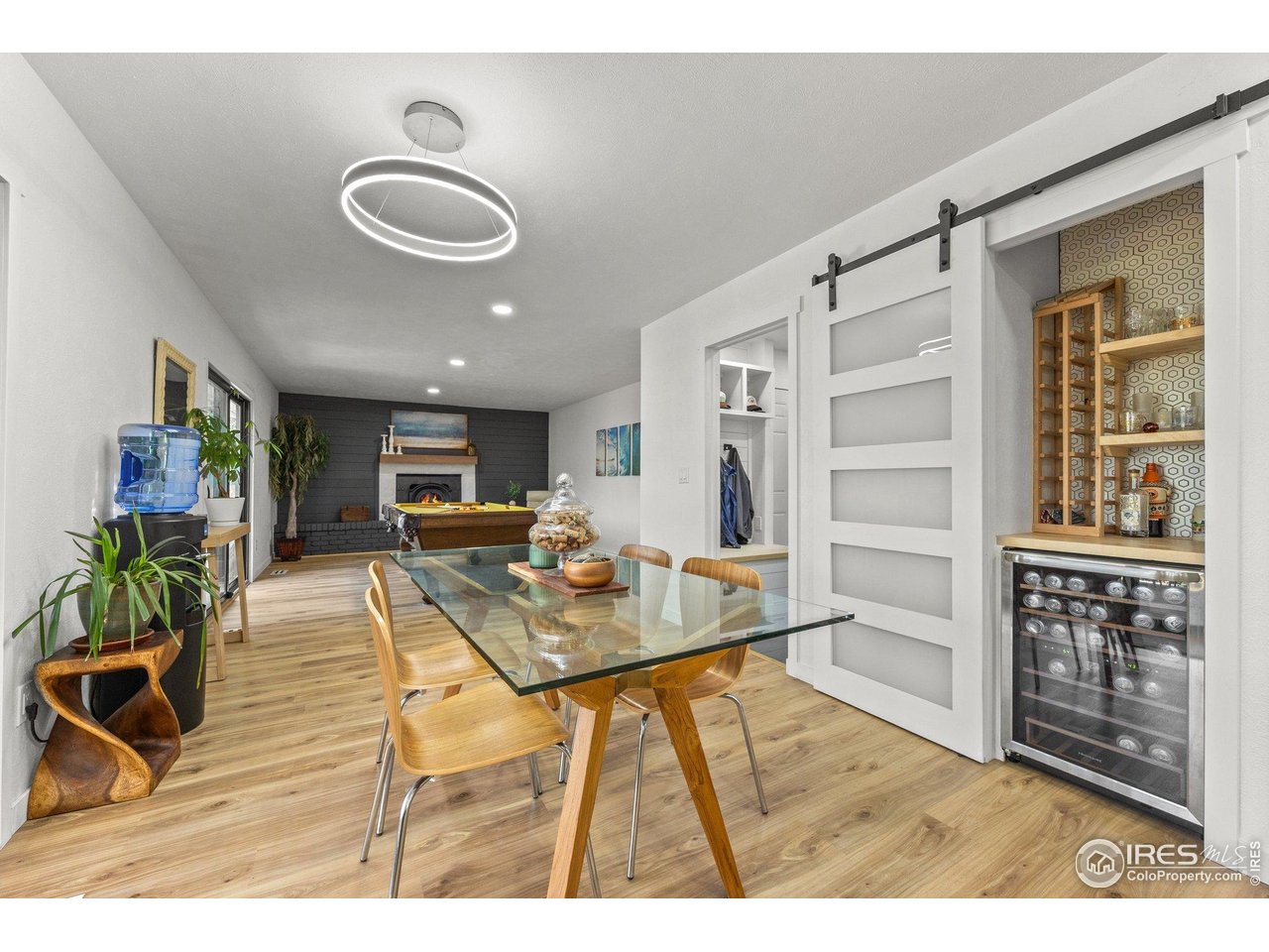 6969 Harvest Road Boulder, CO 80301 - Photo 10 of 39 a view of a dining room with furniture a rug and wooden floor