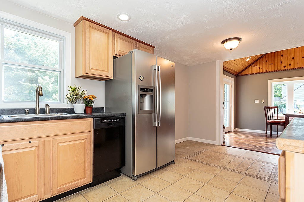 9 Arbor Road Chelmsford, MA 01863 - Photo 3 of 25 a kitchen with stainless steel appliances granite countertop a refrigerator and a sink