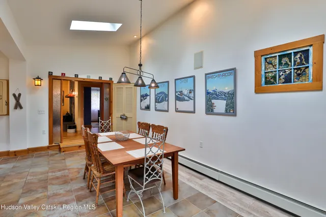 a dining room with furniture and window