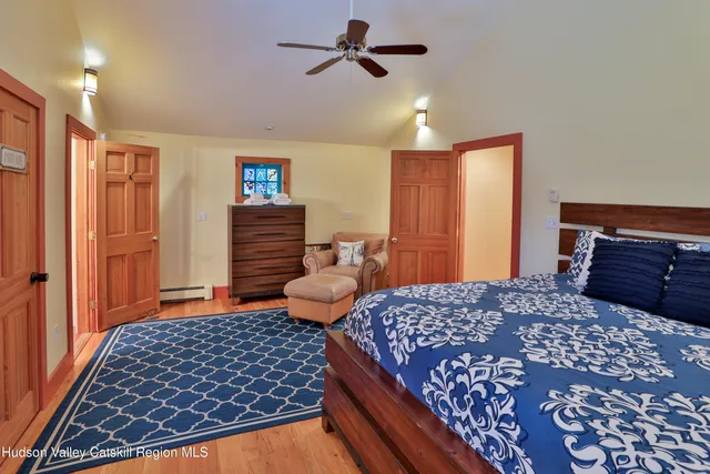 a bedroom with a bed and dresser