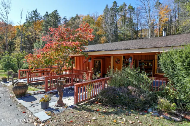 a view of a house with wooden fence