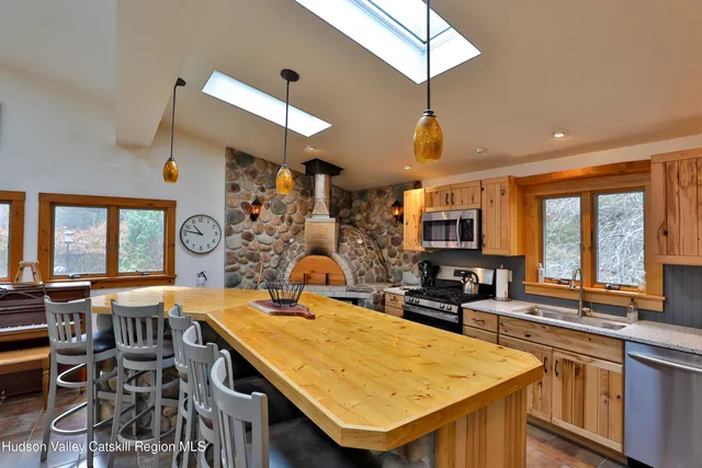 a dining table with chairs and window