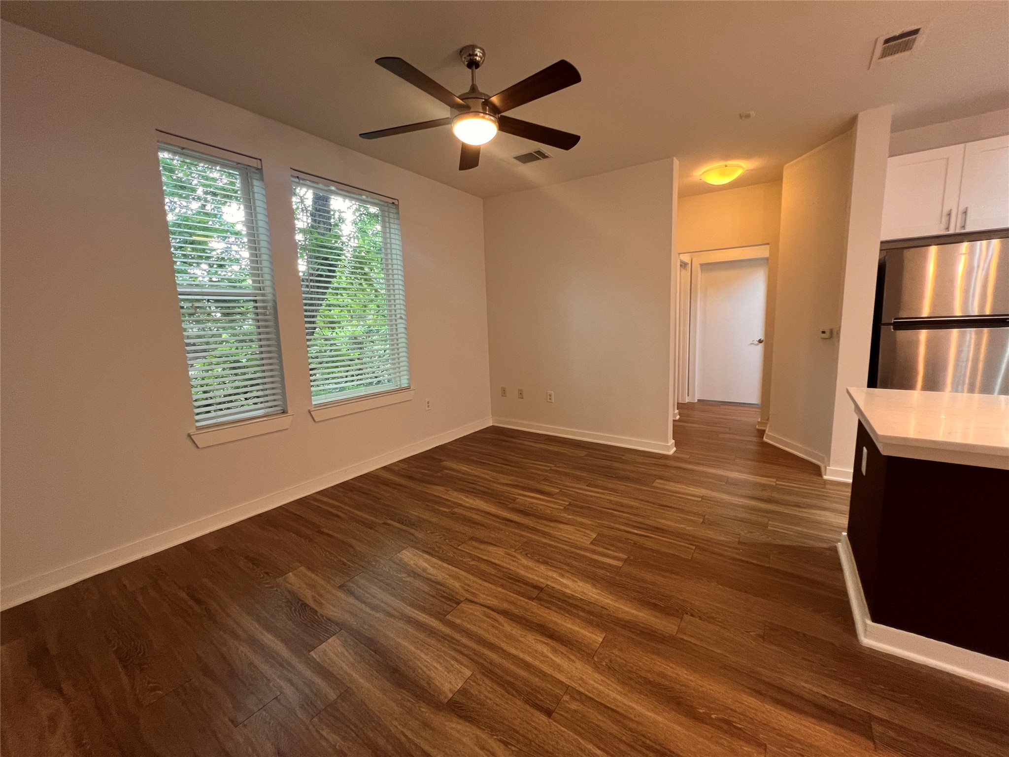 1900 Barton Springs Road, Unit 4041 Austin, TX 78704 - Photo 12 of 35 wooden floor in an empty room with a window