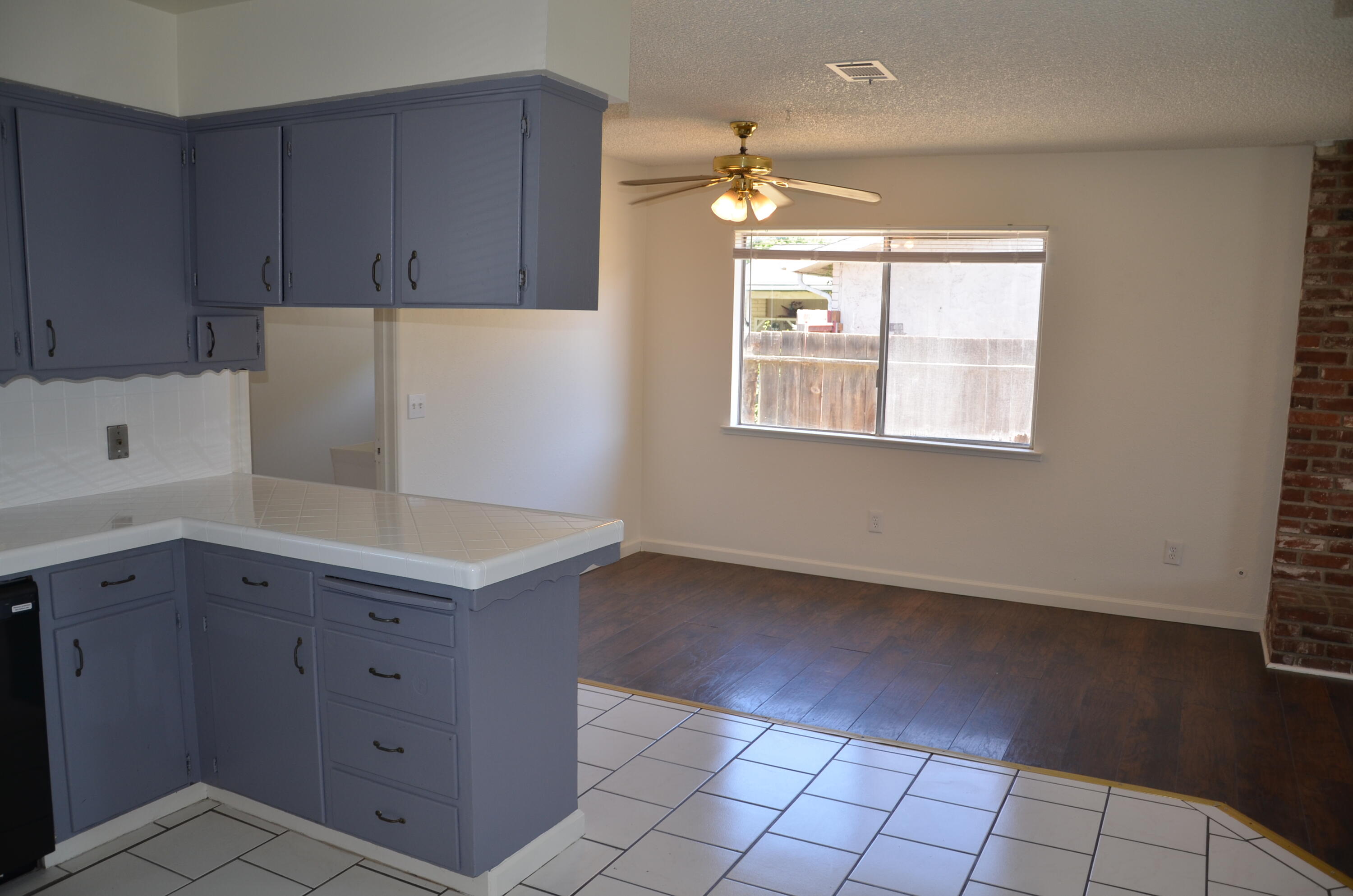339 West Spring Lane Lemoore, CA 93245 - Photo 8 of 31 a kitchen with a cabinets and window