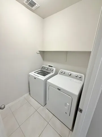 a bathroom with a glass door shower