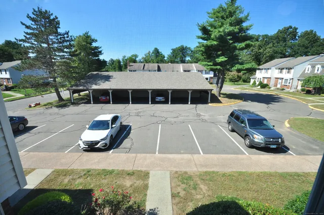 a view of a swimming pool with lounge chairs in patio