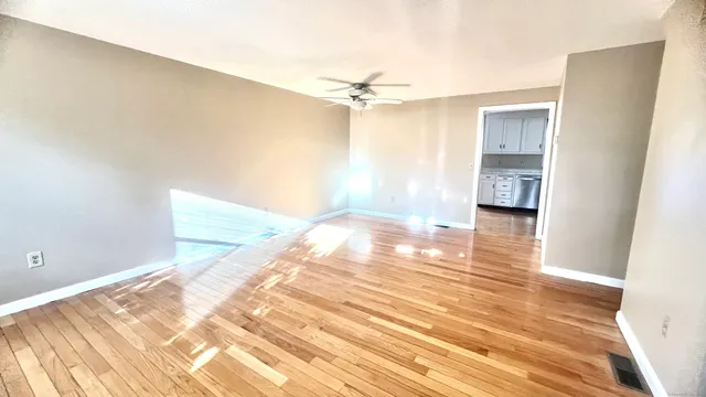 a view of an empty room and window