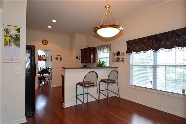 Kitchen features bar counter and an additional eat-in/breakfast area