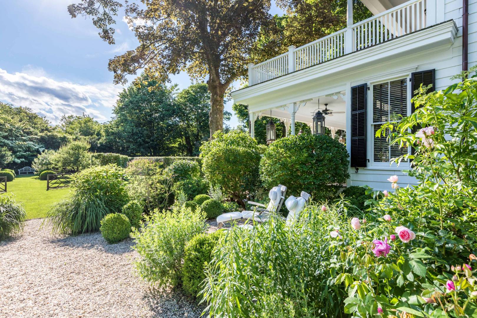 225 First Neck Lane Southampton, NY 11968 - Photo 16 of 32 a view of a house with lots of flower plants