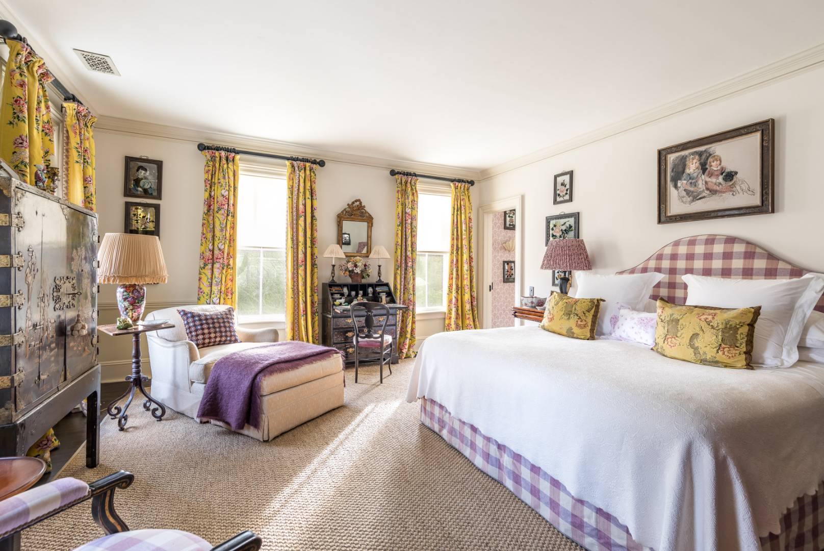 225 First Neck Lane Southampton, NY 11968 - Photo 18 of 32 a bedroom with a bed and a couch