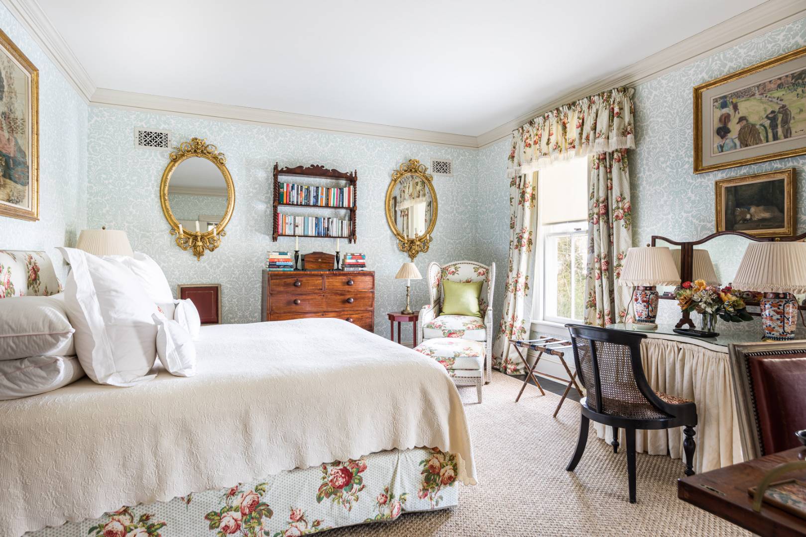 225 First Neck Lane Southampton, NY 11968 - Photo 26 of 32 a bedroom with a bed and a chandelier