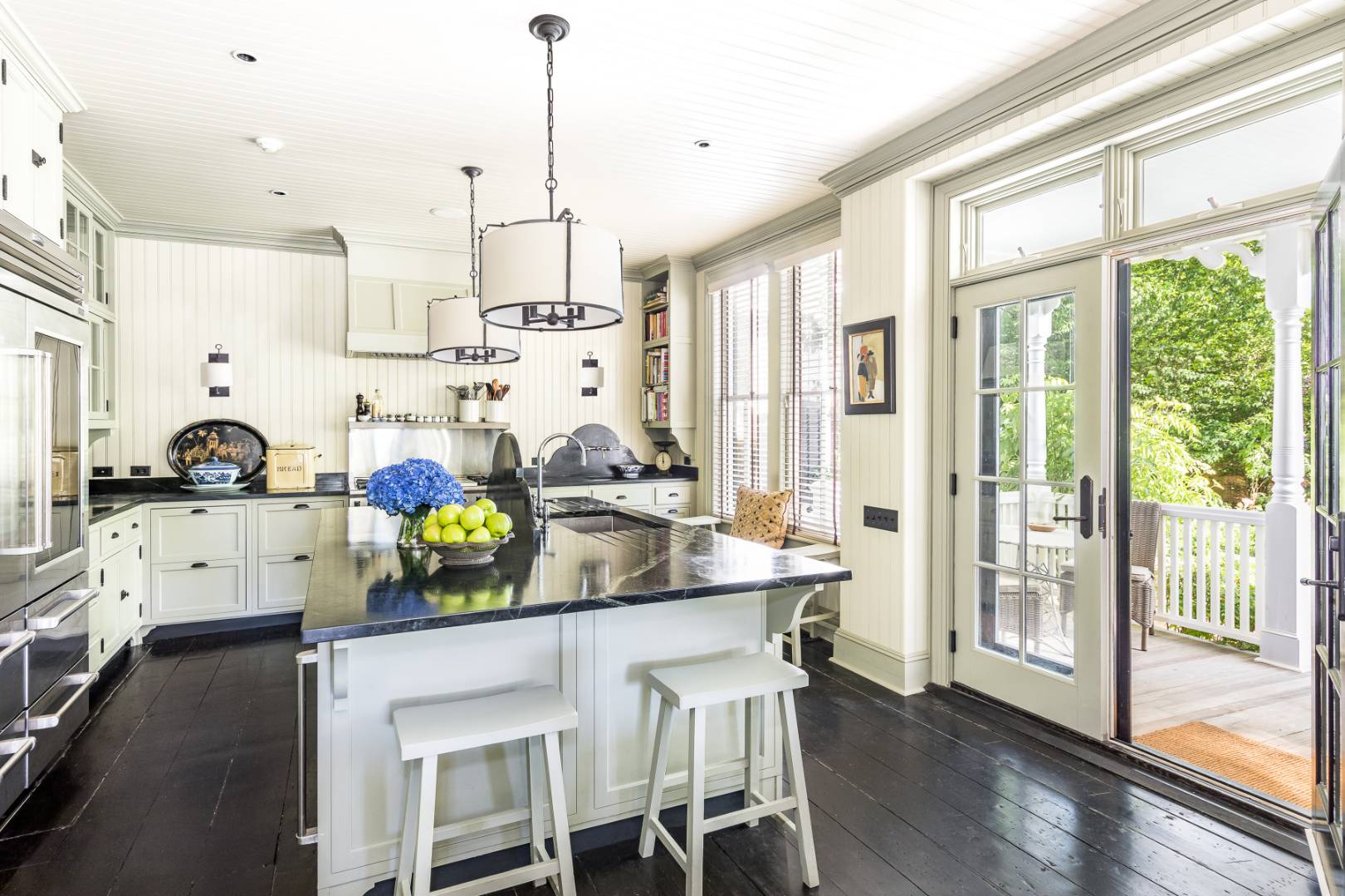225 First Neck Lane Southampton, NY 11968 - Photo 9 of 32 a kitchen that has a lot of cabinets and wooden floor